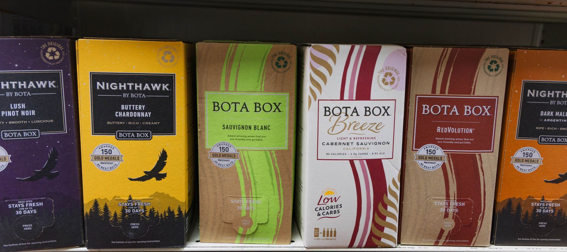 Boxes of Nighthawk and Bota Box products on a shelf.