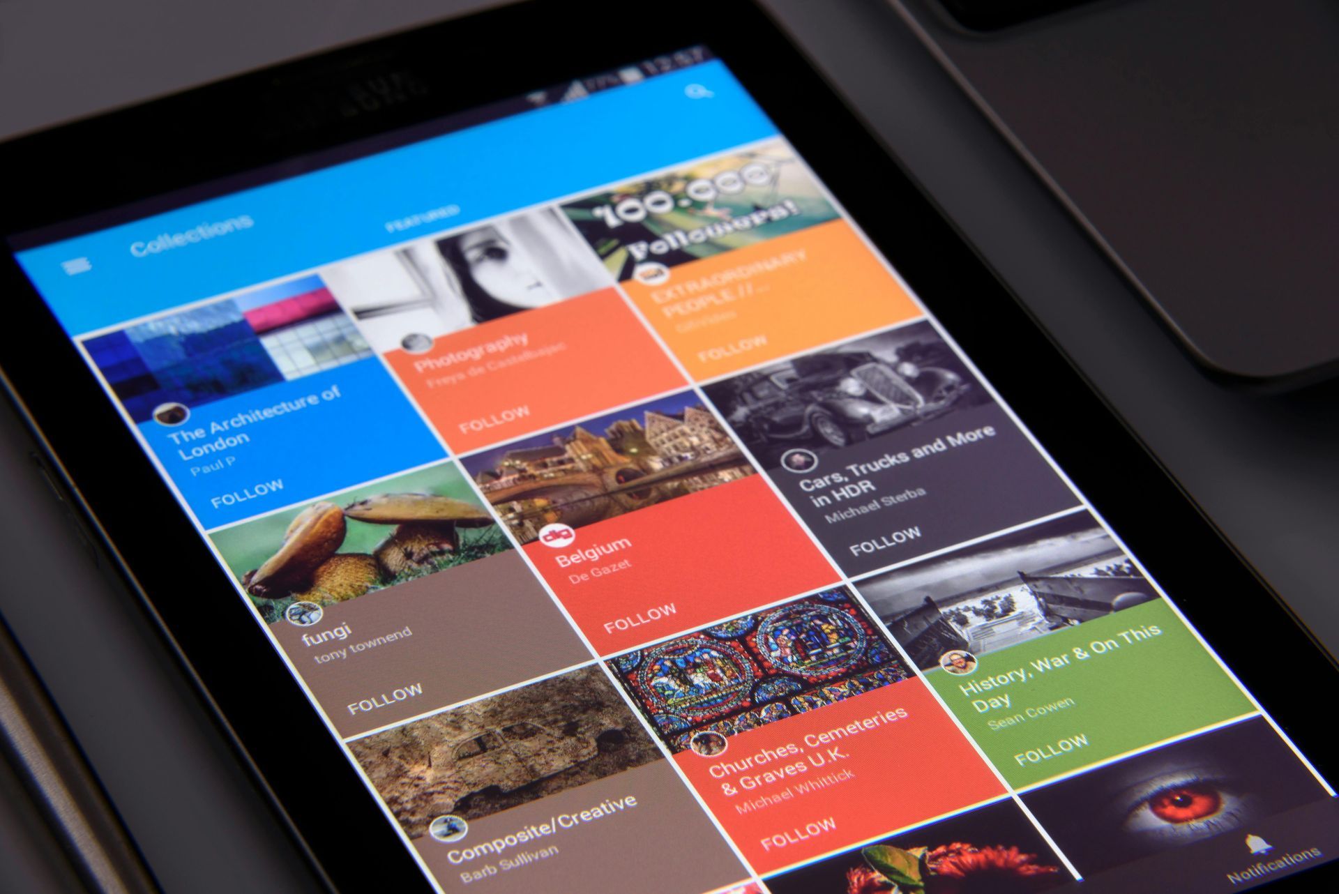 Tablet screen displaying app with colorful collections of images.
