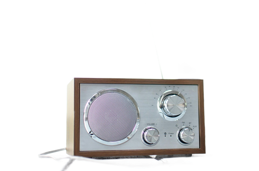 Retro radio with silver face, brown wooden frame, and circular speaker.