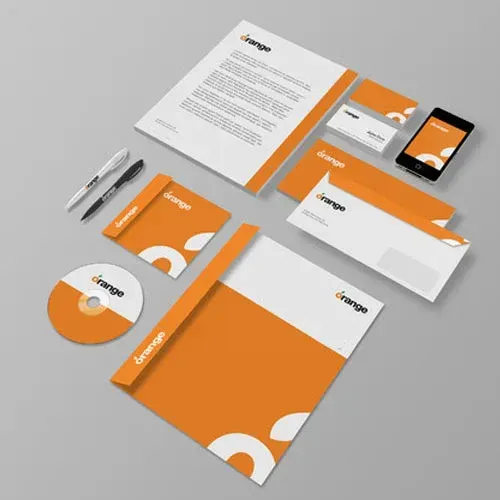 A set of orange and white business cards envelopes pens and a cell phone