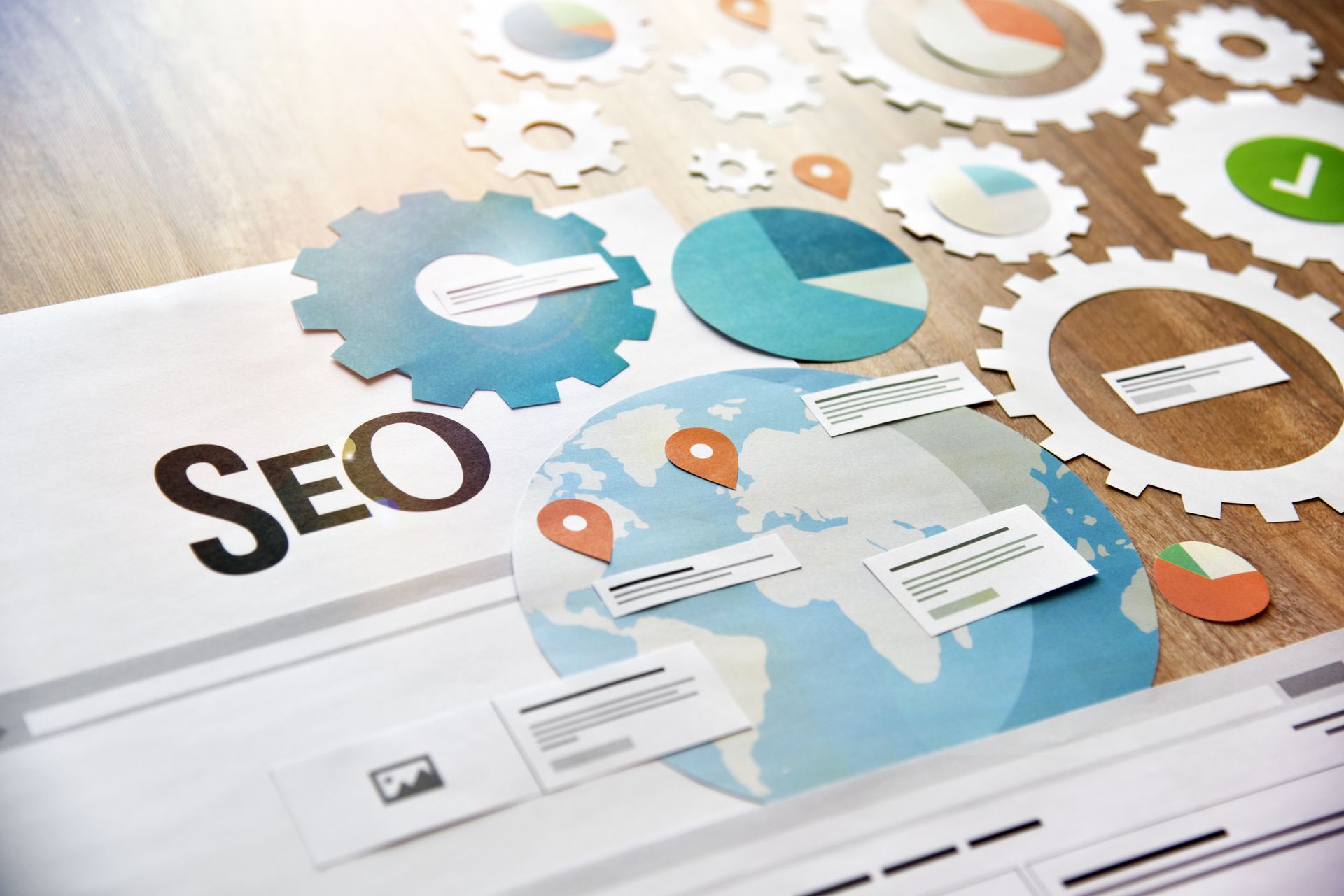 The word seo is on a piece of paper on a wooden table.
