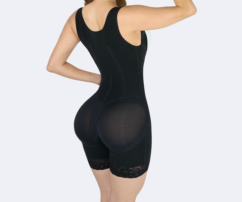 Black body shaper worn by a person, showing the back with compression and shaping features.