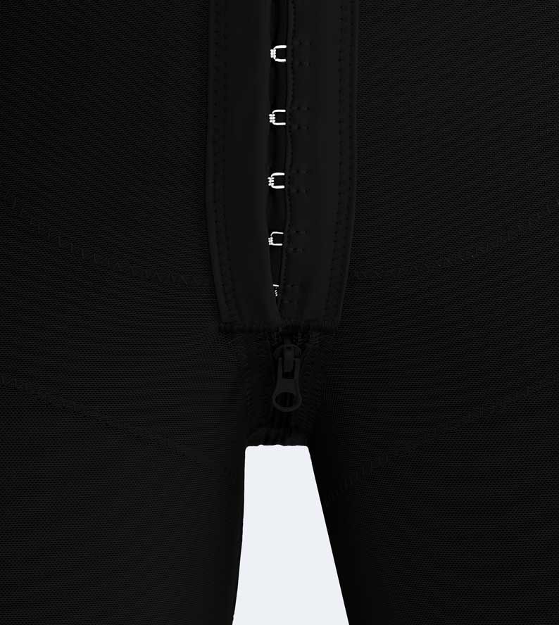 Black compression garment with zipper and hook-and-eye closure.