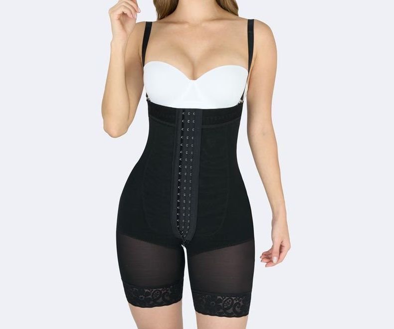 Black compression bodysuit with hook-and-eye closure, worn by a person with a white bra.
