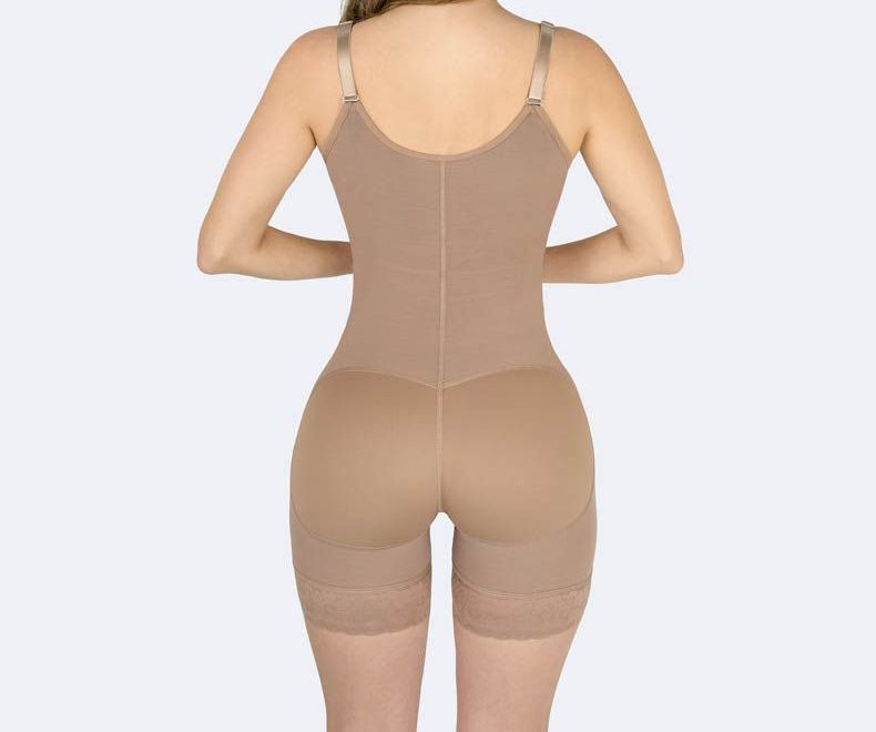 Tan body shaper garment worn by a person, back view.