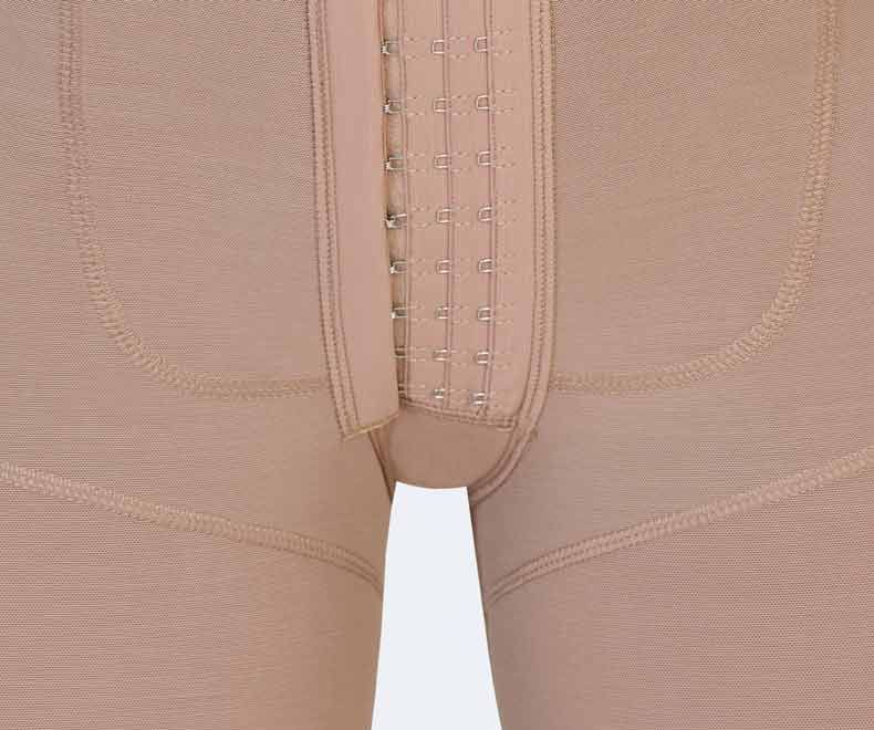 Beige compression garment with hook-and-eye closure along the front center.