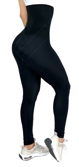 Woman wearing black high-waisted leggings and white sneakers.