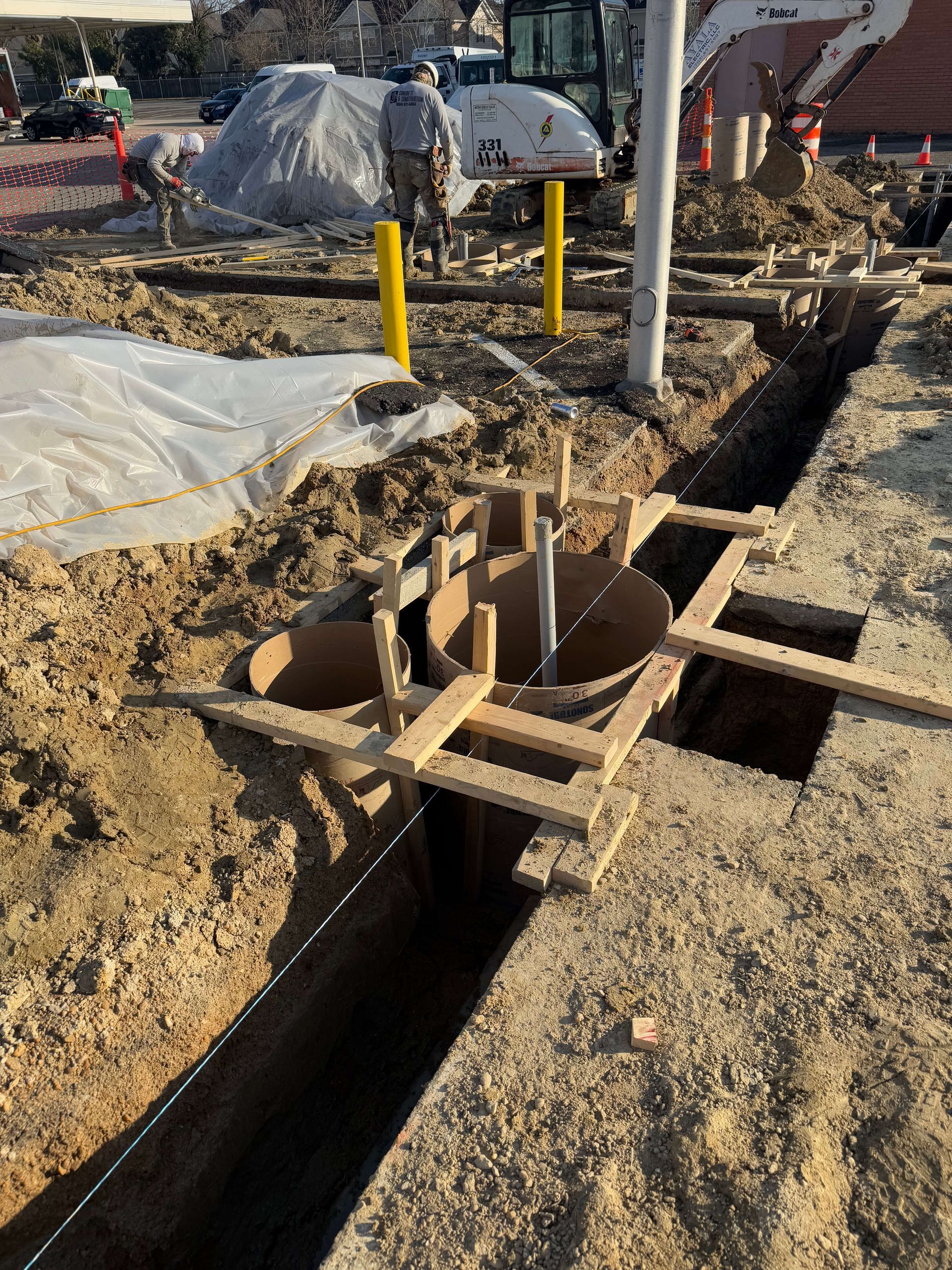 A construction site with a large hole in the ground.
