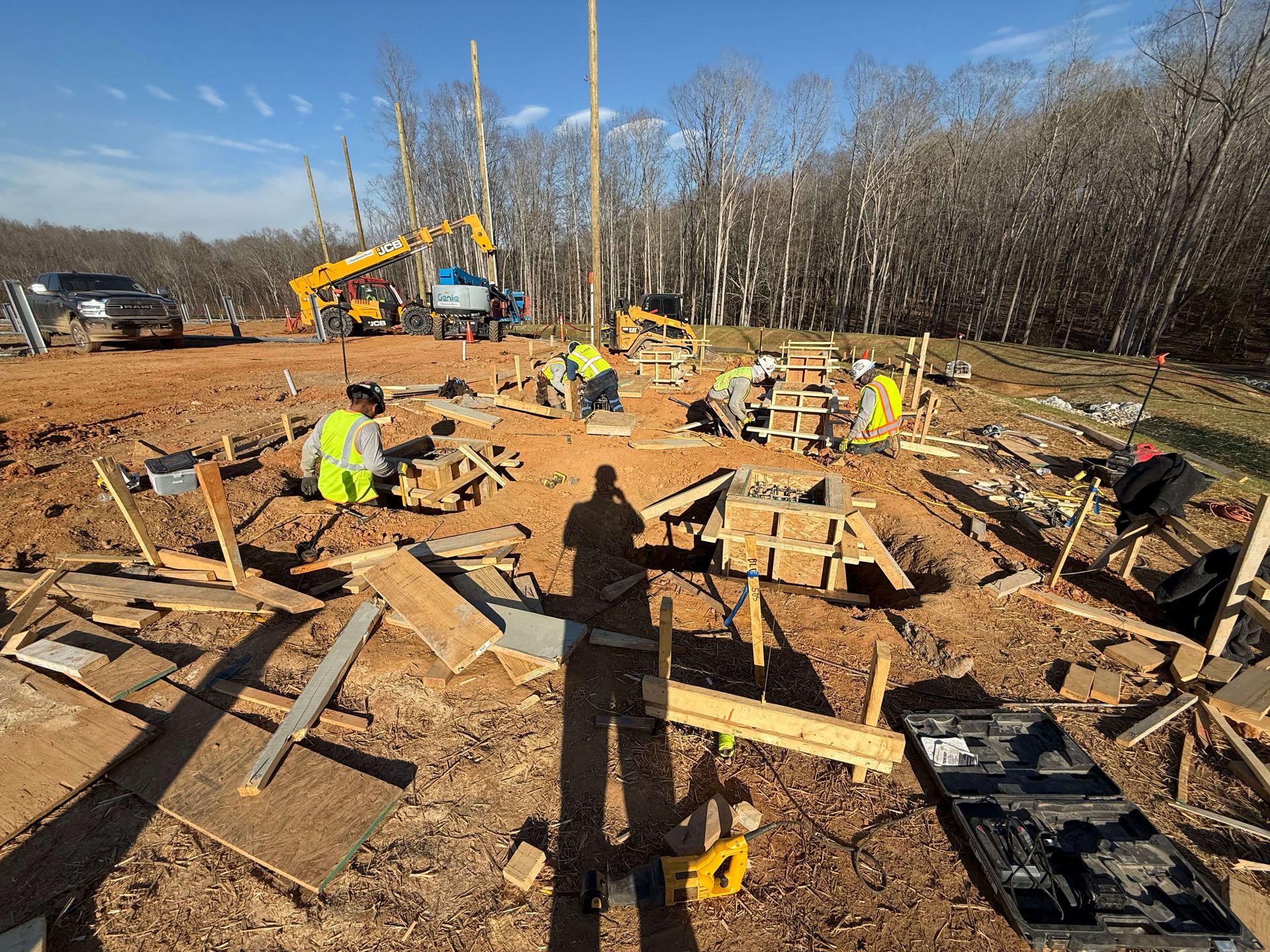 A group of construction workers are working on a construction site.