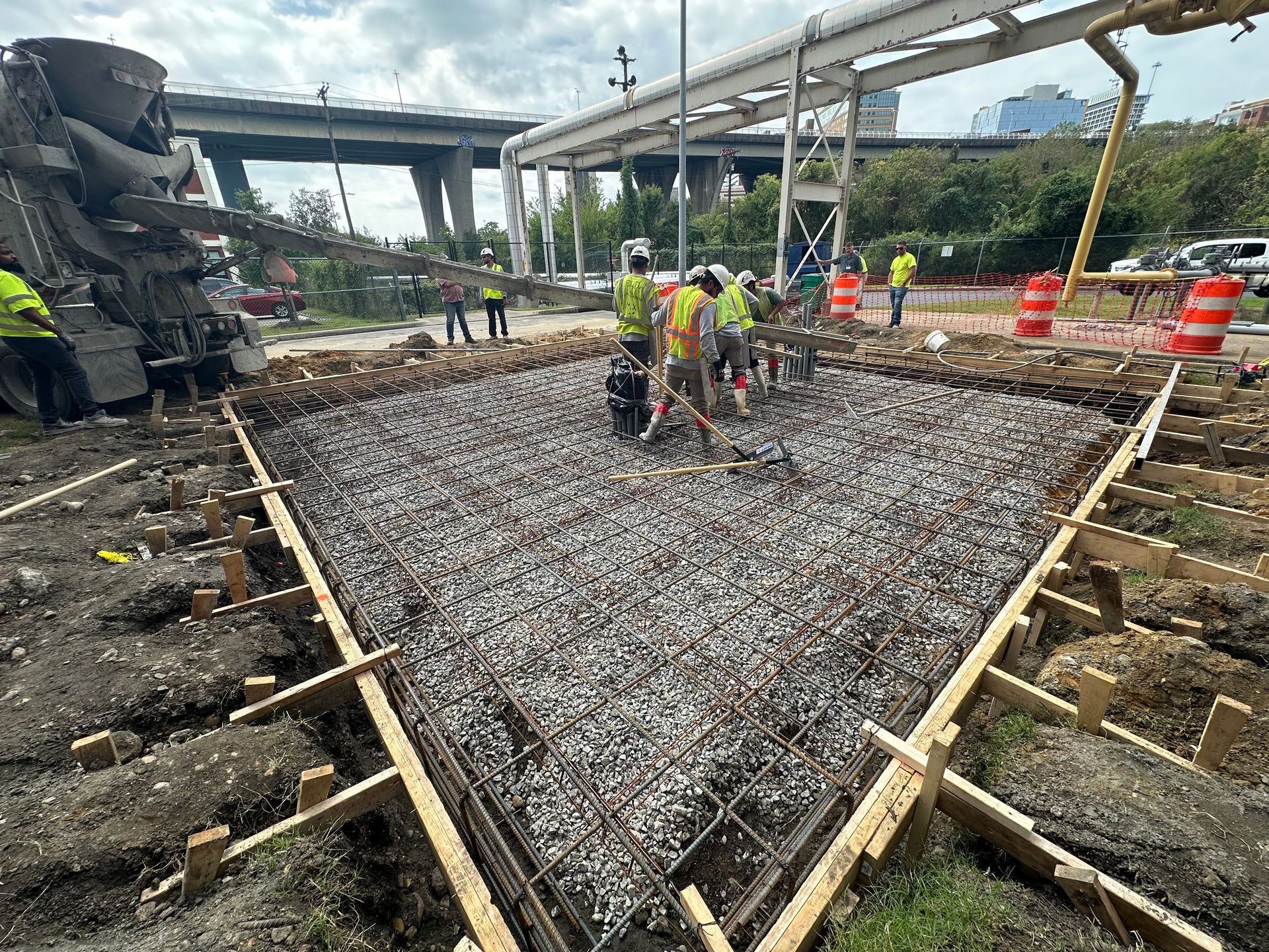 A group of construction workers are working on a construction site.
