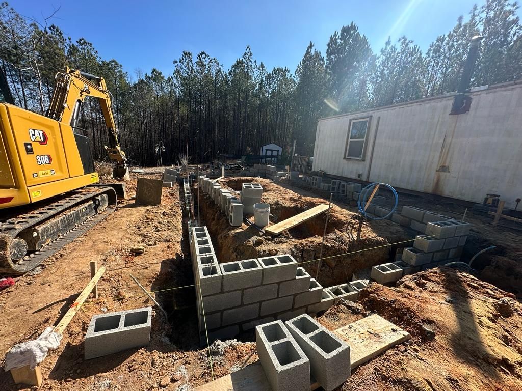 A group of construction workers are working on a construction site.