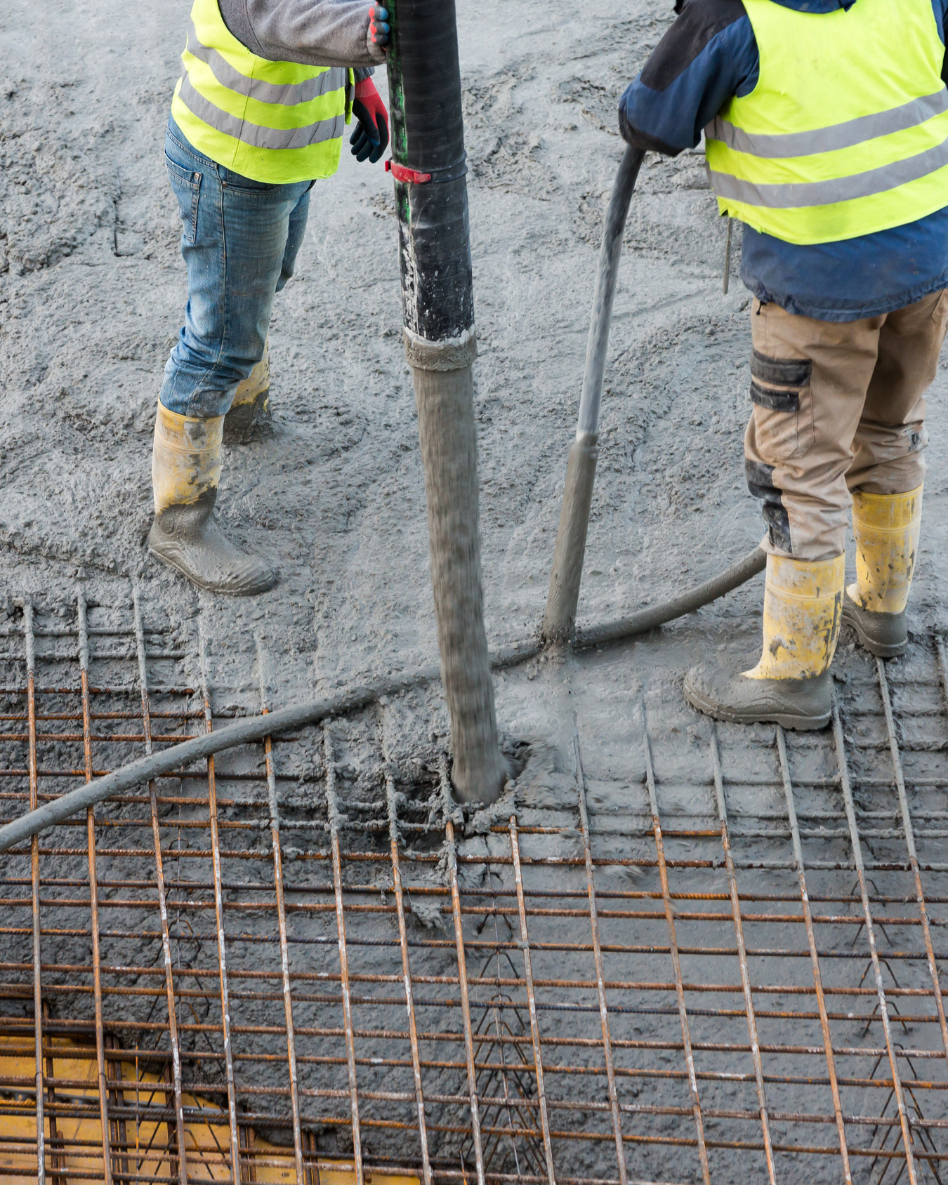 A group of construction workers are working on a construction site.