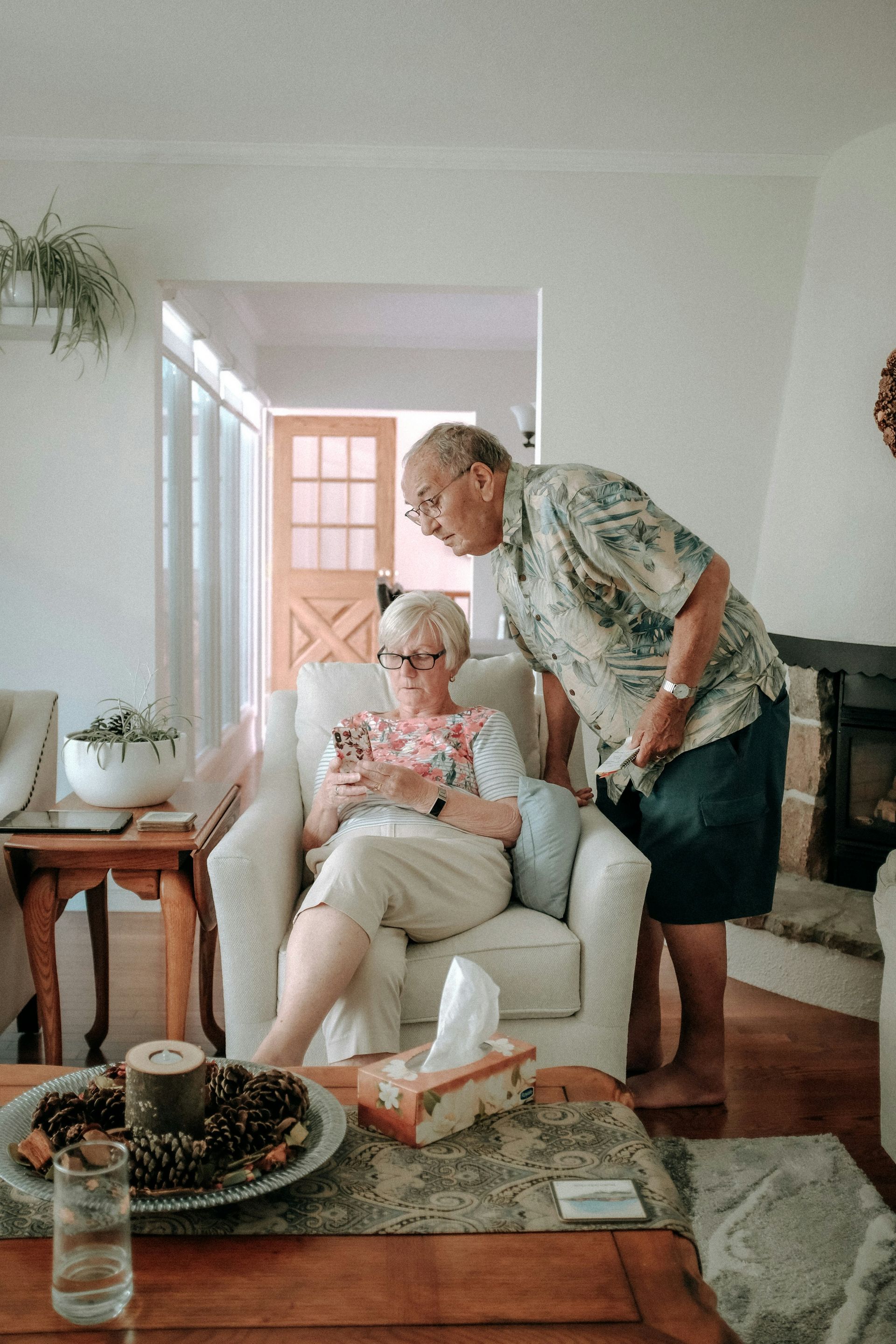 Older couple looking at their phone reviewing their insurance coverage for 2026 as recommended by Chehalem Insurance Associates. 