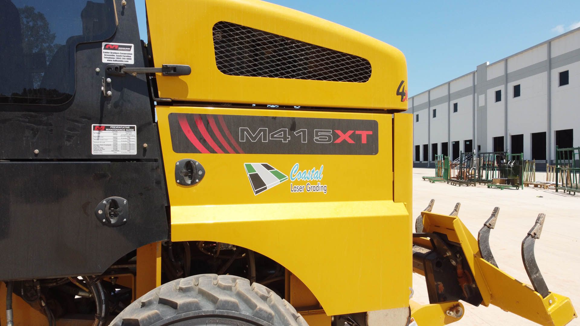 Yellow and black road machine with