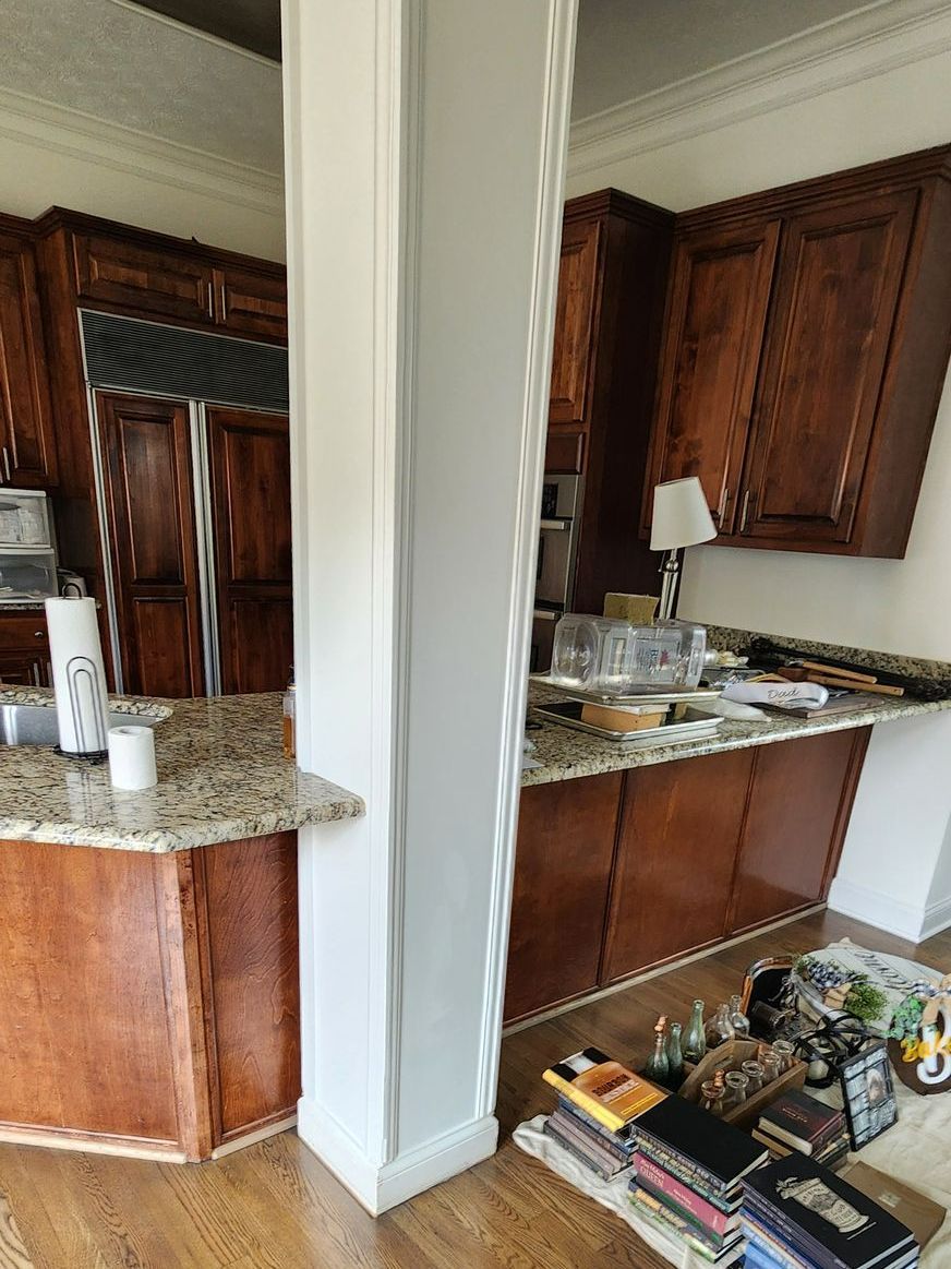 A kitchen with wooden cabinets and granite counter tops is being remodeled - Harrodsburg, KY Southern Elite Coatings LLC 