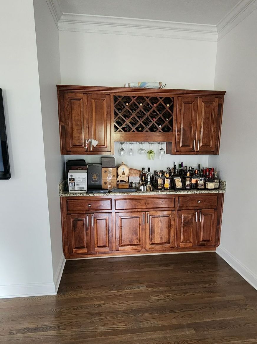 A kitchen with wooden cabinets and a wine rack -Harrodsburg, KY Southern Elite Coatings LLC 