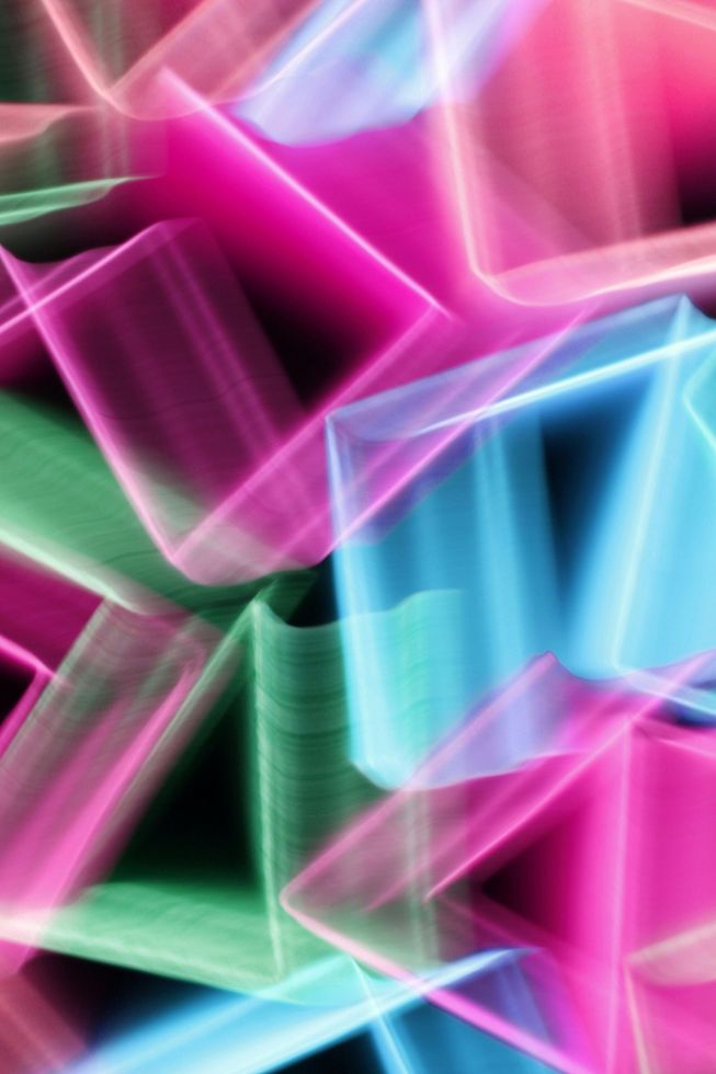 A close up of a colorful abstract background with a black background