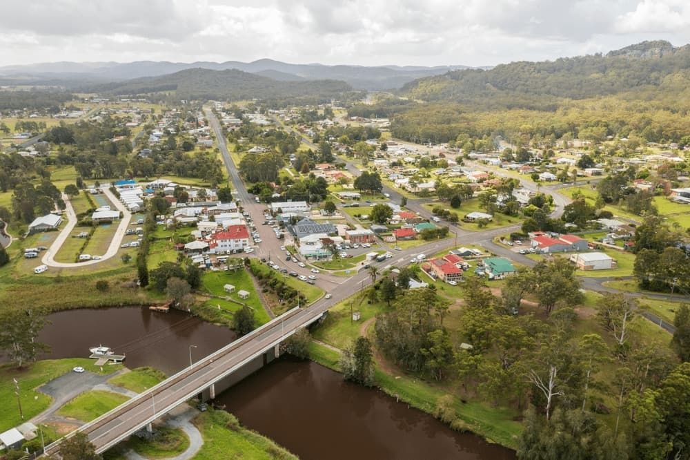 An Aerial View of a Small Town With a Bridge Over a River — Mackie's Concrete Pumping In Bulahdelah, NSW