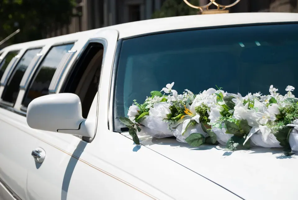 White Wedding Limo with Flowers — Ceres, CA — Luxury Limousine