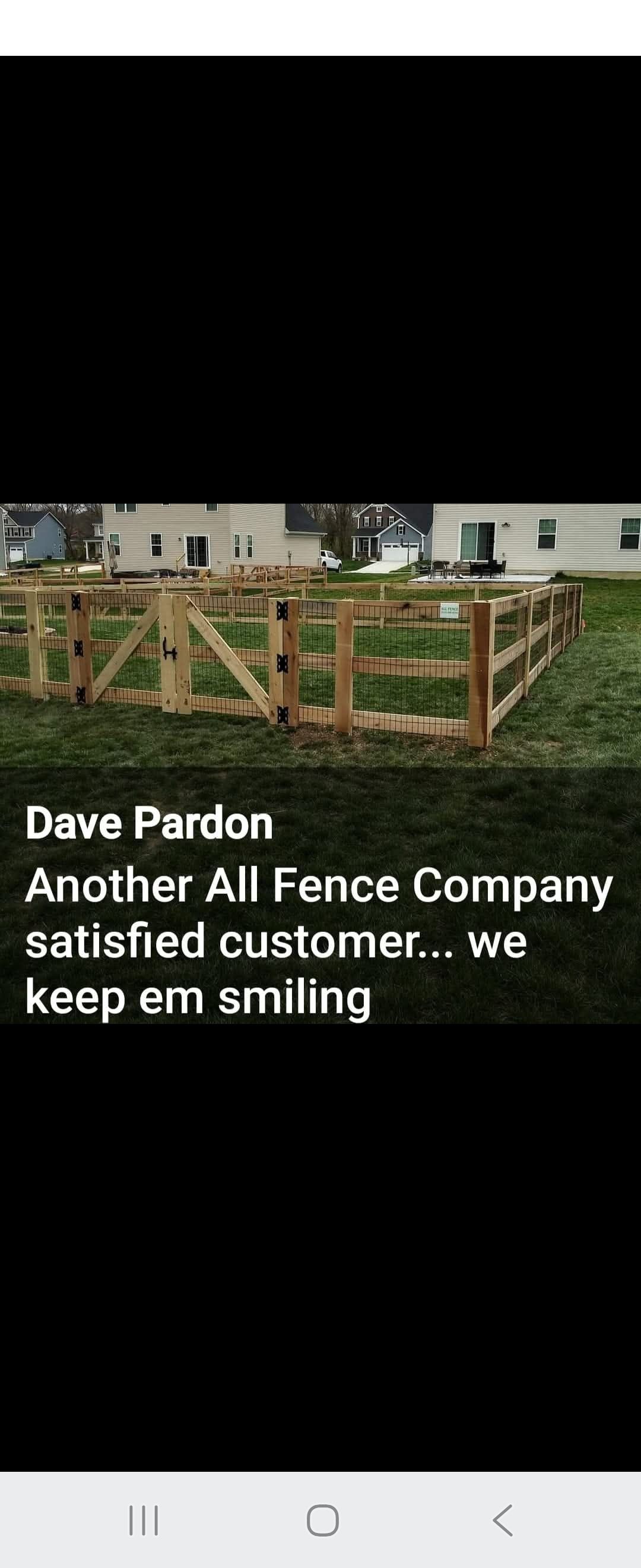Wooden fence in a yard with a house in the background. Text reads 