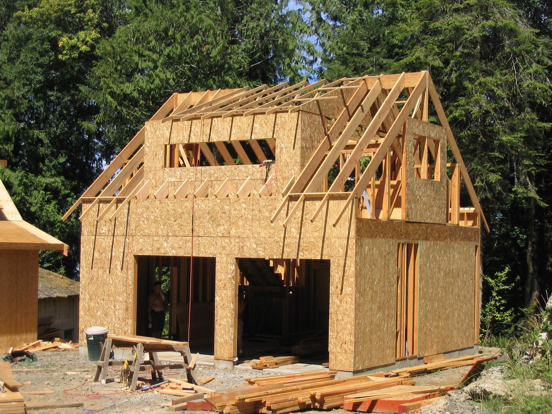 A house that is being built with a lot of wood