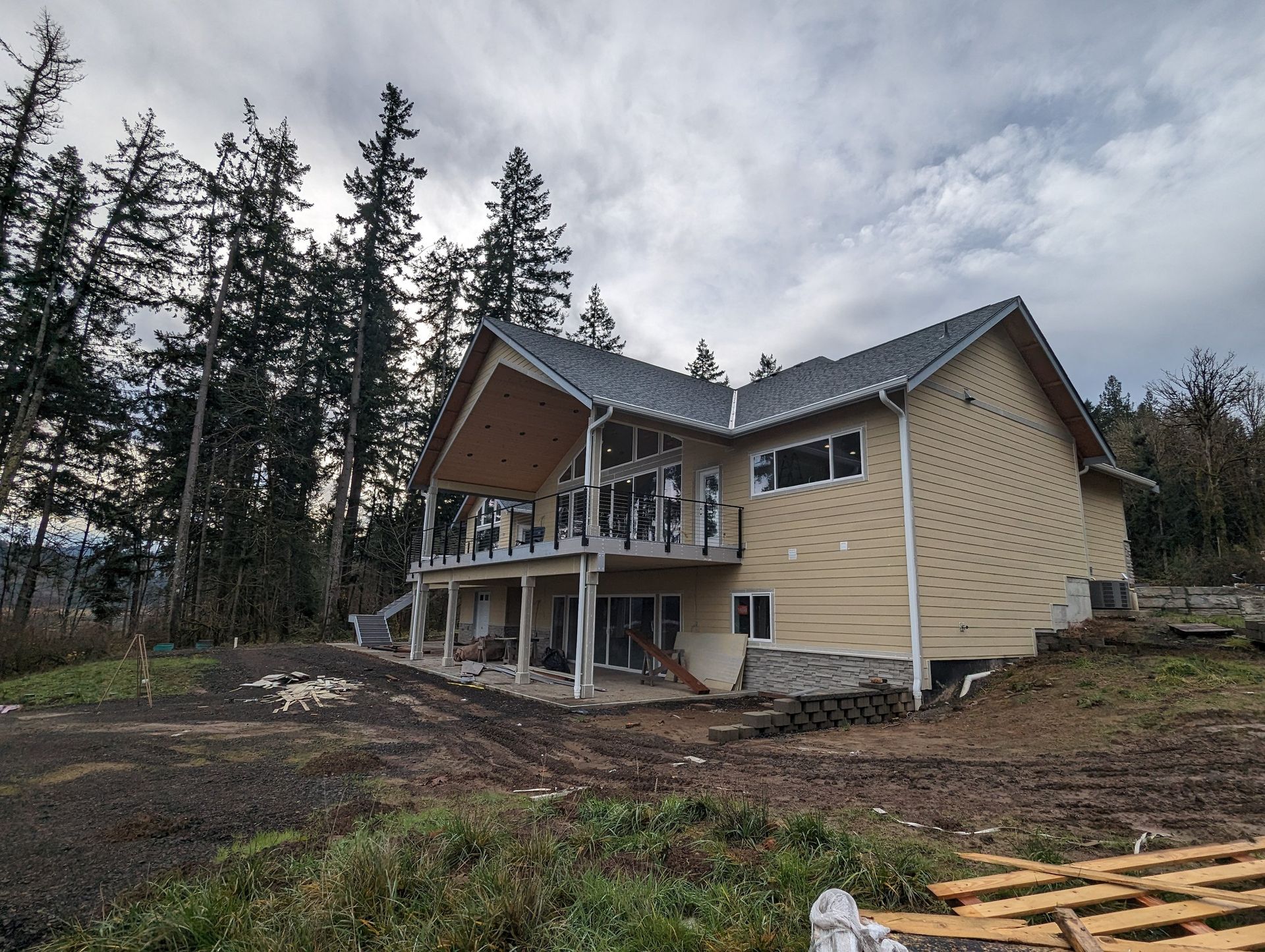 A large house is being built in the middle of a forest