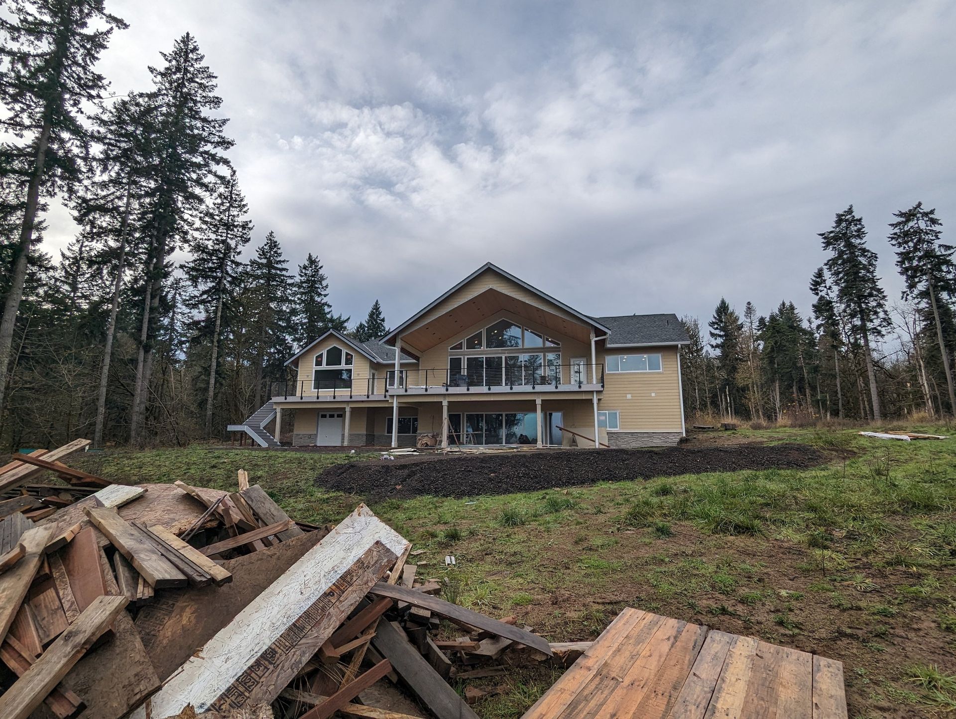 A large house is being built in the middle of a forest