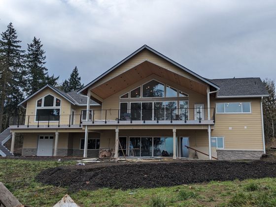 A large house with a lot of windows and a balcony