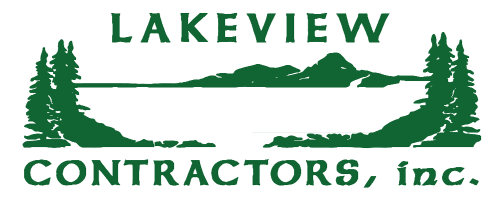 A logo for lakeview contractors inc. with a lake and trees