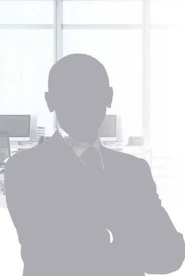 Silhouette of a person in a suit, arms crossed, in an office setting.