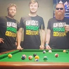 A Group of Men Are Standing Around a Pool Table — CKM Screen Printing in West Gosford, NSW