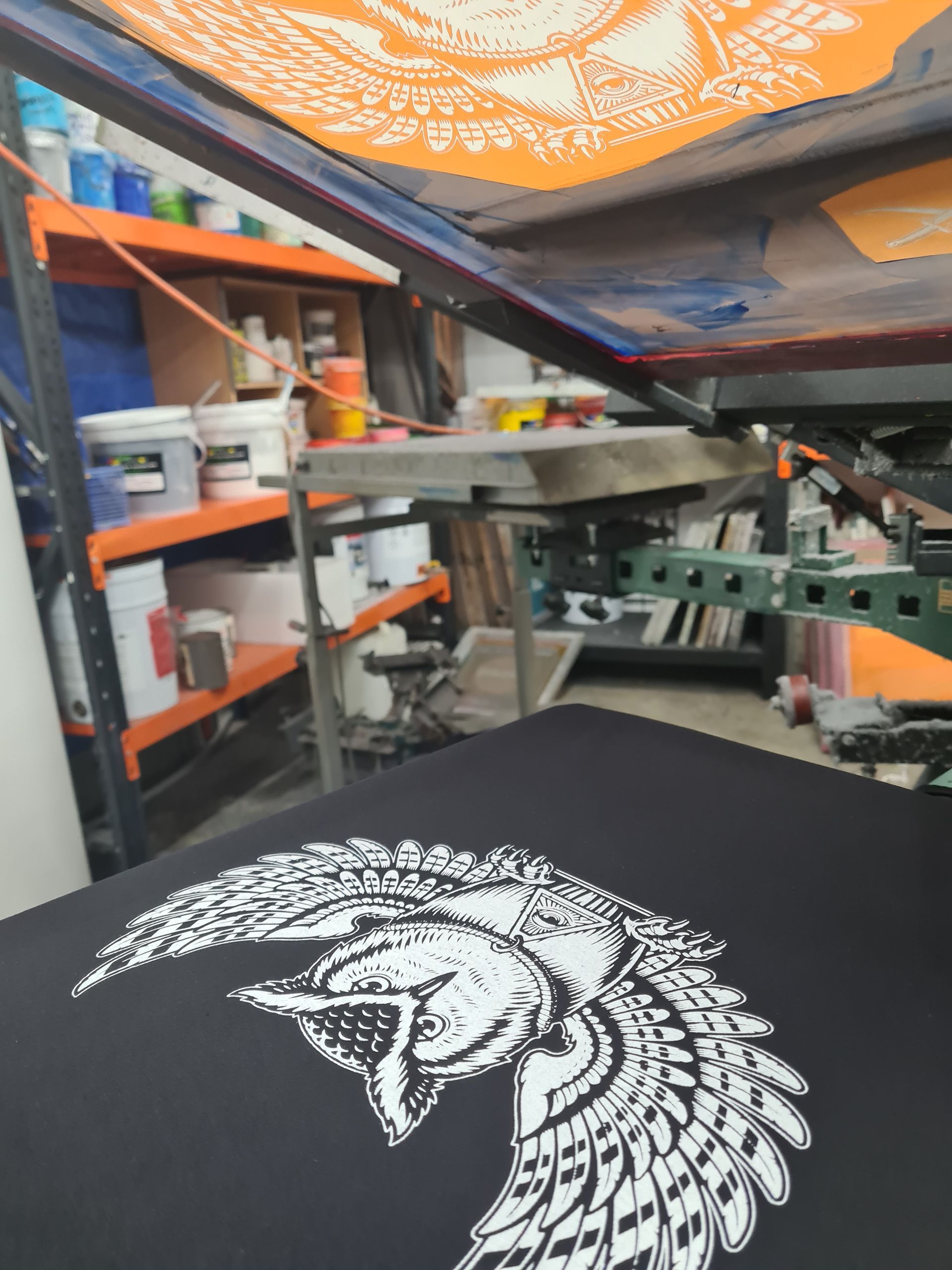 A T-Shirt Is Being Screen Printed with A White owl — CKM Screen Printing in West Gosford, NSW