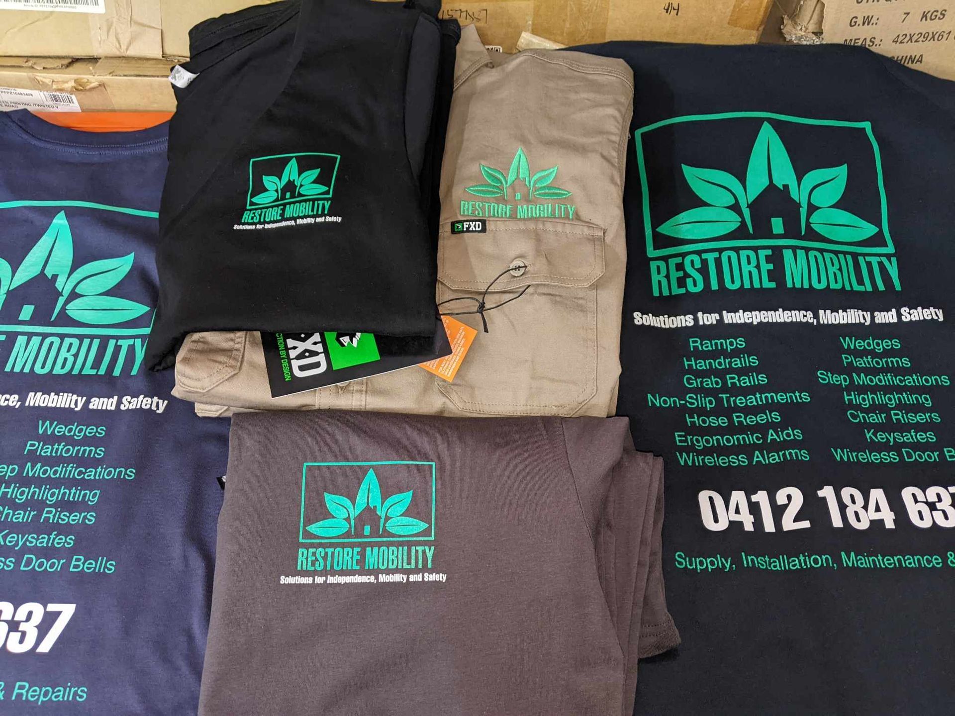 A Person Wearing a White T-Shirt with A Picture of A Hand Holding a Game Controller — CKM Screen Printing in Woy Woy, NSW