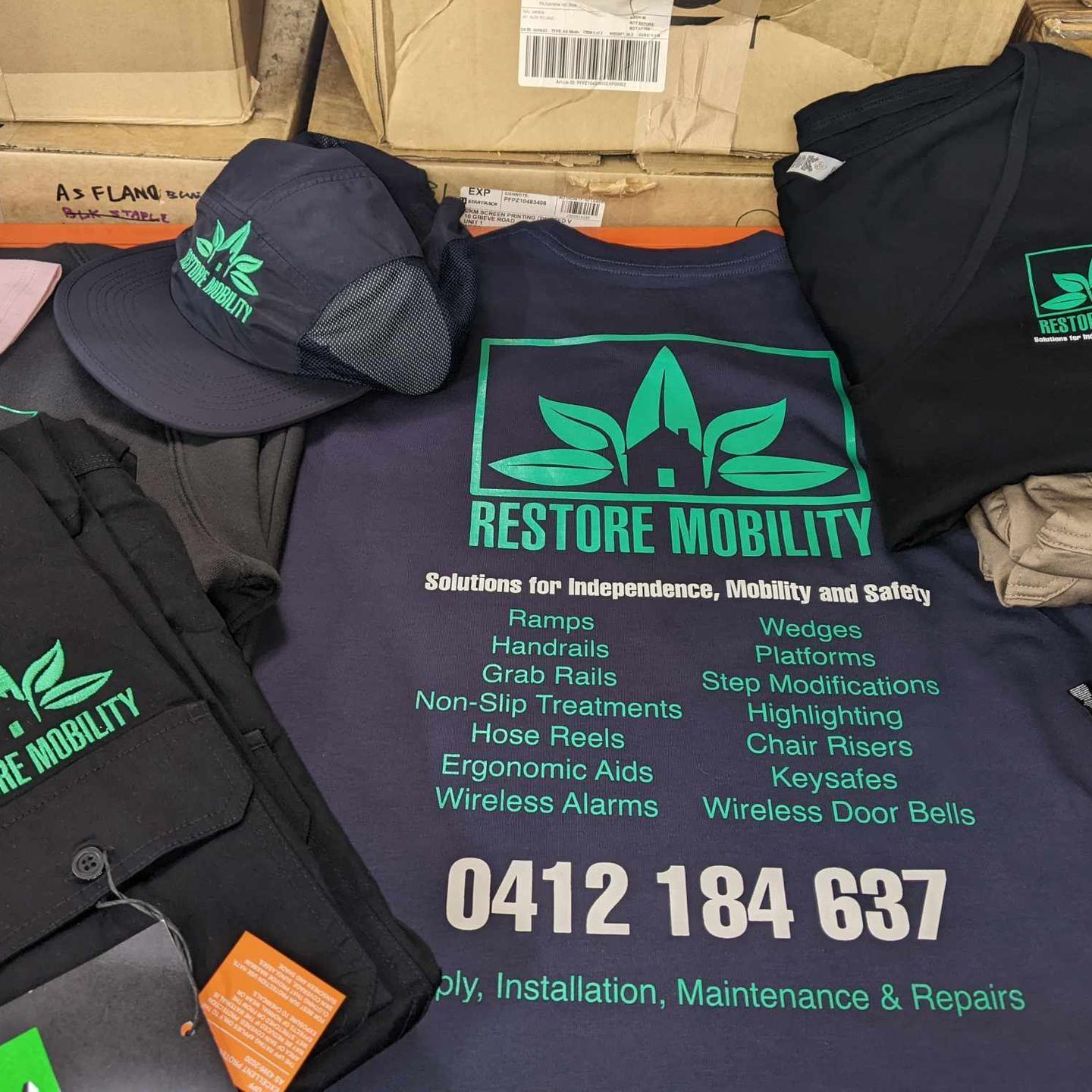 A Pile of Screen Printed Merchandise — CKM Screen Printing in West Gosford, NSW