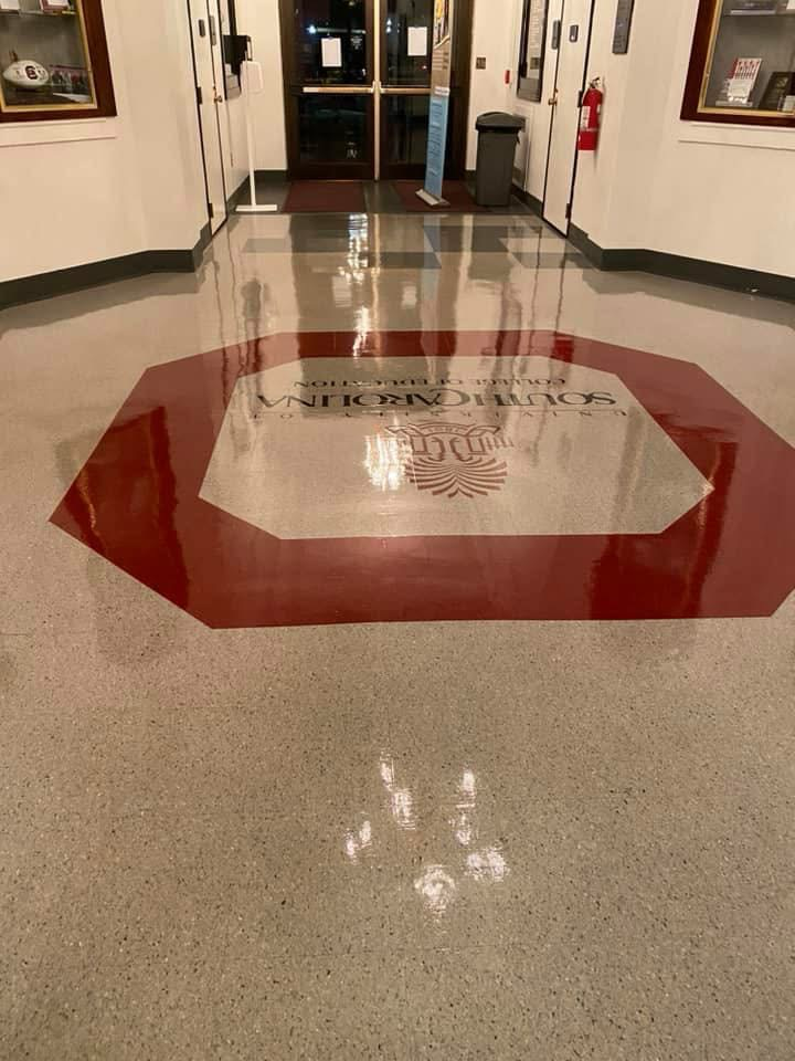 Polished floor with red octagon around text reading