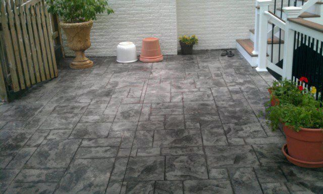 Outdoor Home Repairs — House with flower pots in Woodbridge, VA