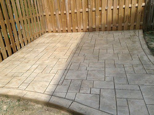 Floor Coverings — Concrete floor and wooden fence in Woodbridge, VA