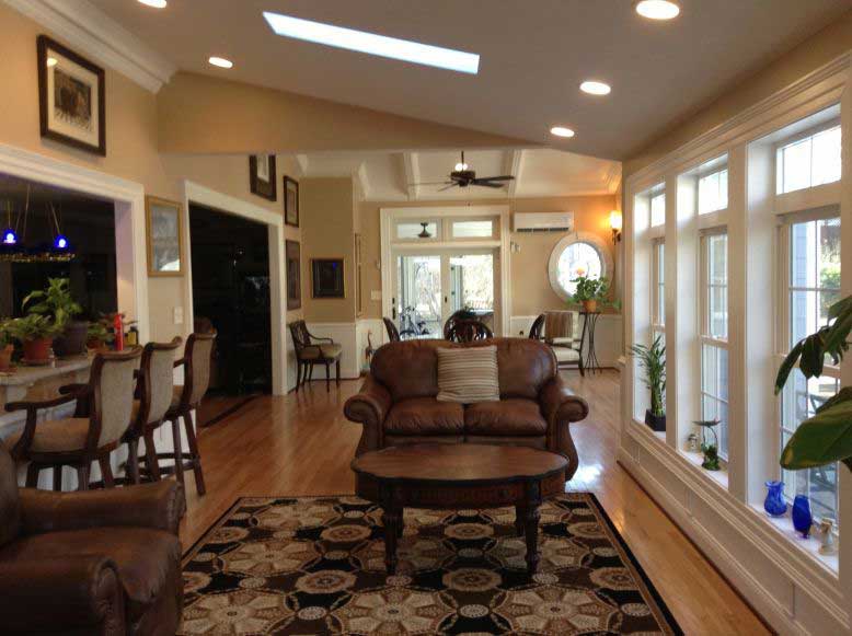 Basements Space — Designed living room with brown chairs in Woodbridge, VA