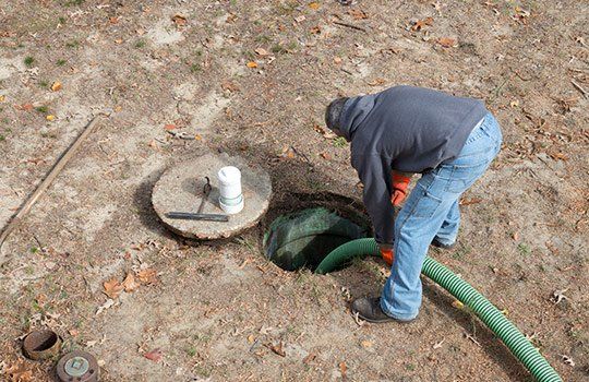 Worker Pumps Residential Septic Tank — Richmond, VA — Dowdy’s Well & Septic Service