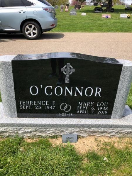 A black gravestone with the name o ' connor on it