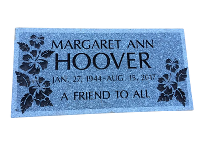 A gravestone for margaret ann hoover with flowers on it