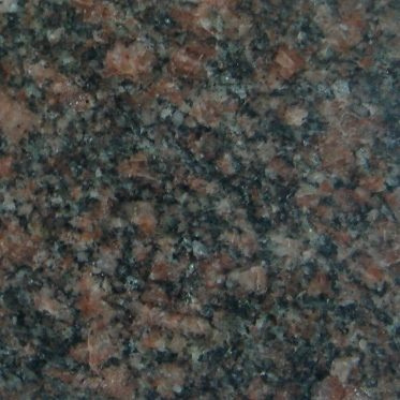 A close up of a brown granite counter top.