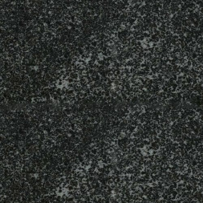 A close up of a black granite counter top with white spots.