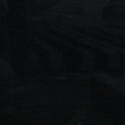 A close up of a black background with a grainy texture.