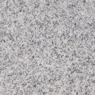 A close up of a white granite counter top.