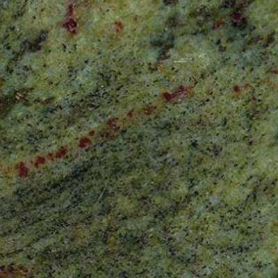 A close up of a green granite slab with red spots.