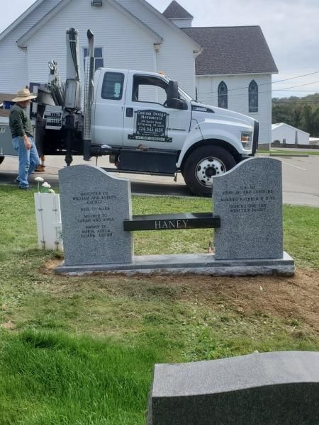 A truck with the word granite on the side of it
