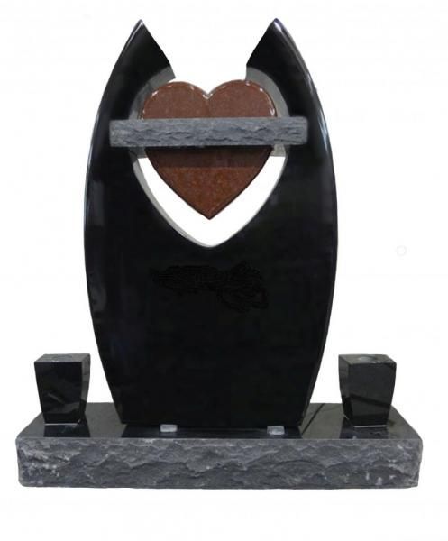 A black monument with a heart in the middle