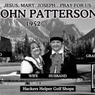 A black and white photo of a man and woman standing next to each other.