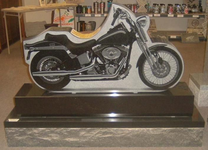 A statue of a motorcycle is on display in a room
